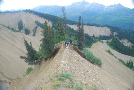 Stephanie Perry and Jeff Benowitz hiking along a ridge-top of unconsolidated interbedded gravel and sand within the Pliocene Nenana Gravel, Suntrana Creek, south-central Alaska (Photo Paul Fitzgerald).